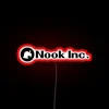 Nook Incorporated home decor statement in bold black neon letters.