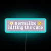 Neon Sign with Customizable Message 'Normalize Hitting The Curb Bumper'