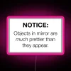 Neon warning sign with humorous 'objects in mirror' phrase led.