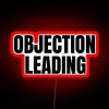 Courthouse objection sign in bold, colorful, neon RGB lighting.