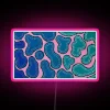 Vibrant neon ombre waves glow with colorful LED RGB lighting.