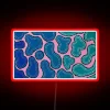 Vibrant ombre wave LED neon art decoration with color changing effects.