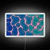 Colorful ombre wave design LED sign with vibrant RGB lighting.