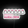 Supportive healthcare team members unite with this vibrant neon sign.