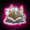Open Book with Vibrant Flowers and Color-Changing Neon Light Sign