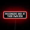Warning: passengers ride at their own risk with colorful helmets