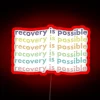 Recovery is possible, hope shines in pastel hued neon light.