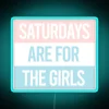 Vibrant pastel pink Saturday night decor with colorful neon accents