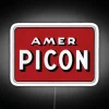 Retro bar aesthetic with Amer Picon branded RGB neon signage.