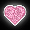 Vibrant pink cheetah print LED heart sign with colorful neon accents