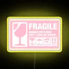 LED pink fragile warning sign with vibrant colorful neon lighting