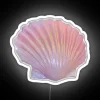 Glowing pink seashell shaped LED lighted decorative room accent neon sign.