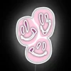 Vibrant Pink Neon Sign with Brightening Smiles in Colorful RGB Lighting
