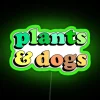 Vibrant Neon Sign Featuring Plants and Happy Canines Together