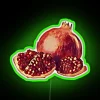 Vibrant pomegranate fruit motif illuminated by colorful RGB neon lighting