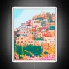 Authentic Italian coastal town charm illuminated in vibrant neon lights.
