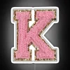 Neon sports letter K with preppy pink varsity glow effect.