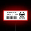 Neon logo sign featuring the iconic Capsule Corp. symbol.