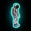 Colorful psychedelic astronaut neon sign in vibrant RGB lighting colors.