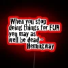 Add a touch of literary style with Hemingway quote neon