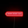Fun aviation-themed 'Remove Before Flight' warning sign in RGB neon.