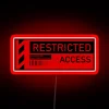 Security warning restricted access to authorized personnel only neon sign