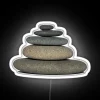 Rock formation with vibrant neon lights on transparent background.
