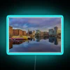 Vibrant Salthouse Dock cityscape at dusk in long exposure neon.