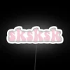 Vibrant Neon Sign Featuring Colorful Turtle Silhouettes in Rainbow Hues