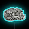 Modern vibrant glowing neon sign featuring snow leopard design artwork.