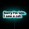 Colorful apology for being late due to feline distraction neon sign