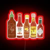 Vibrant Hot Sauce Collection Neon Sign in Bold Black Background
