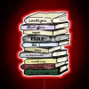 Neon literature quote symbolizing love for reading amidst vibrant colors.