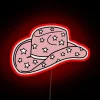 Add vintage Western charm with glow-in-the-dark cowgirl hat decor.