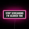 Colorful RGB neon lighted stop screaming scared too statement sign