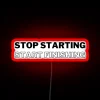 Motivational wall sign with RGB neon letters: Productivity meets perfection.