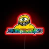 Vibrant prismatic geode Cyclops logo sign in neon RGB lighting.