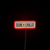 Vibrant neon art featuring childlike sun symbol in radiant colors.