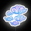 Neon tattoo clouds glow in vibrant RGB colors at night.