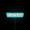 Vibrant 'That's My Secret' neon stress relief desk decoration with RGB lighting.