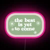 Neon sign featuring optimistic phrase in green & pink hues.