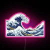 Vibrant neon sign featuring iconic Hokusai wave art in color