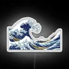 Vibrant LED art reproduction of Hokusai's iconic Japanese wave design.