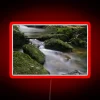 Mystical scene of glowing water and vibrant rock formations