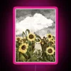 Neon sign featuring eerie sunflowers with ghostly presence at dusk.