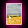 Mysterious neon sign featuring a ghostly wheat field encounter