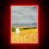 Mysterious spirit haunts rural landscape in vibrant RGB neon glow