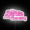 Neon Sign Featuring Barbie in Lab Coat Studying Chemistry