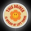 Whimsical neon decoration featuring a nervous driver's humorous left turn anxiety.