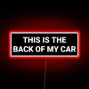 Neon bumper decoration highlighting humorous sentiment on your car's rear